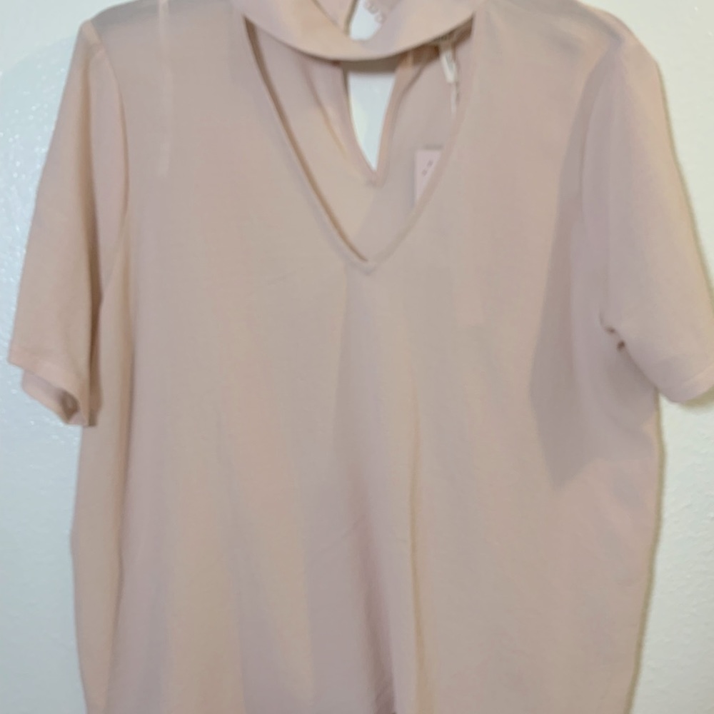 Dusty pink.  Blush color.   Short sleeve. Medium